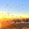 Cappadocia hot air balloon panorama view at sunrise with balloons flying over fairy chimneys