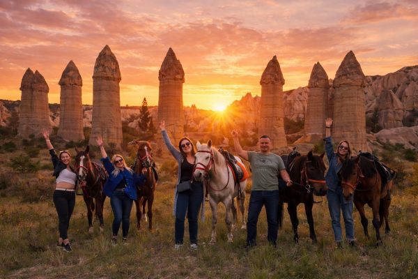 Cappadocia horse riding tour through fairy chimneys and valleys at sunset