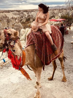 Cappadocia camel ride tour through fairy chimneys and valleys at sunset