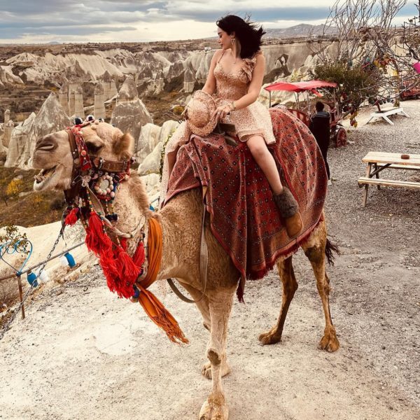 Cappadocia camel ride tour through fairy chimneys and valleys at sunset